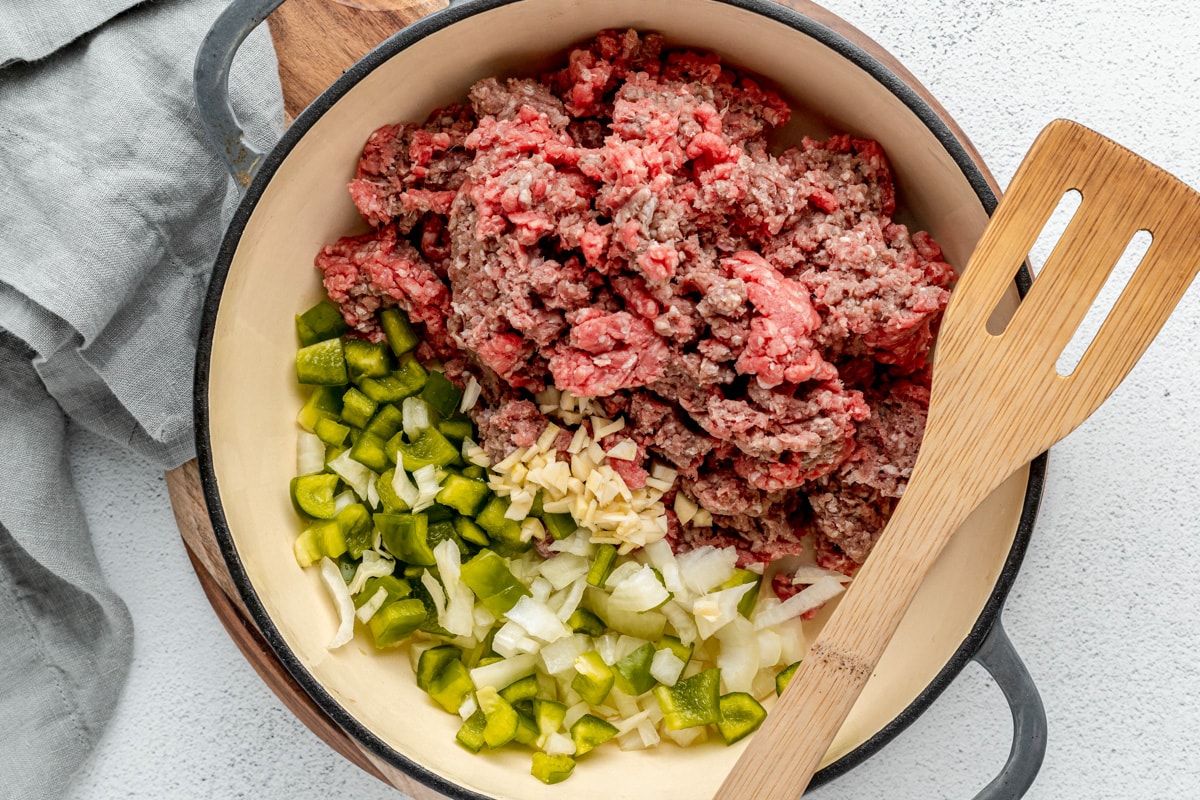 Combined meat ingredients in a pot for making homemade sloppy joes.