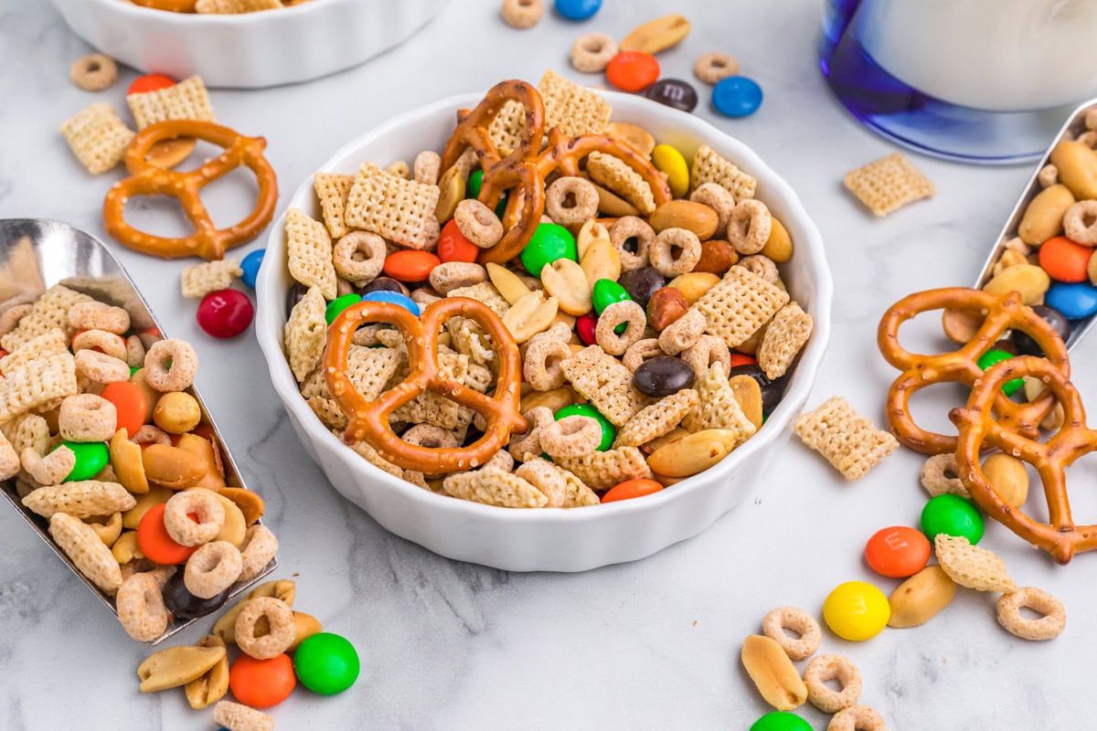 A white bowl of sweet and salty chex mix.