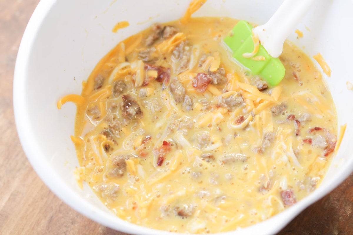 Egg mixture in bowl for tater tot breakfast casserole.