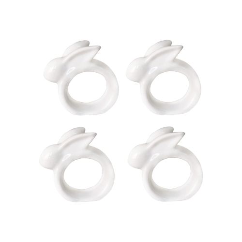 Set of four white porcelain bunny napkin holders.
