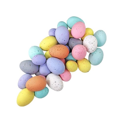 A pile of foam Easter eggs in various light colors.
