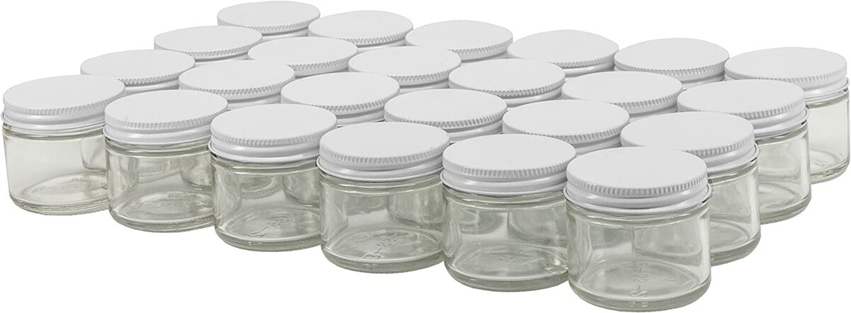 Pantry Organization Ideas - several small glass jars with white screw-on lids.
