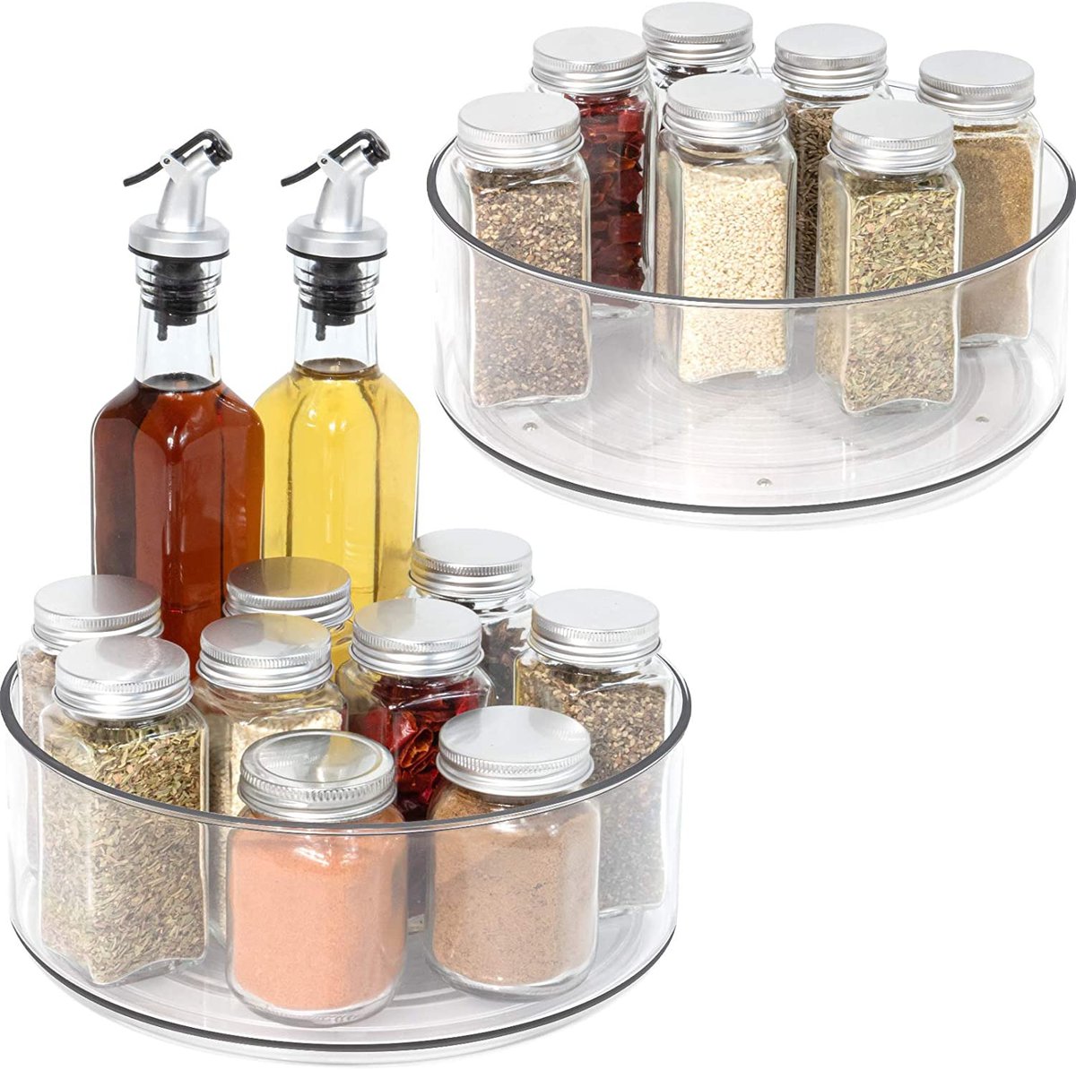 Pantry Organization Ideas - two clear plastic lazy susans filled with small jars of spices and two tall jars of oil and vinegar.