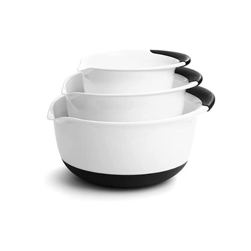 A set of three white mixing bowls with pour spouts.