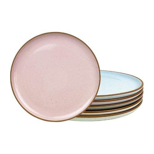 An upright pink plate next to a stack of other pastel colored stacked plates.
