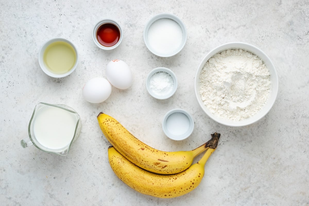 Ingredients for how to make banana pancakes on the counter.