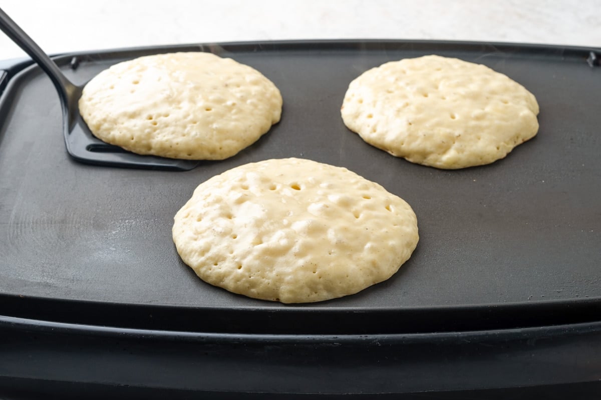 How to make banana pancakes - cooking on a griddle.