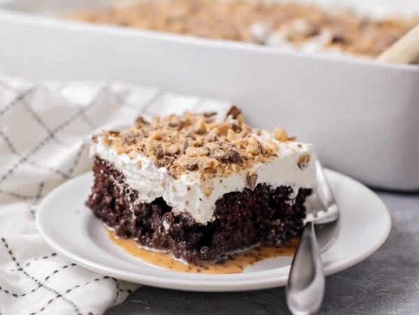 A slice of better than anything cake served on a white plate.