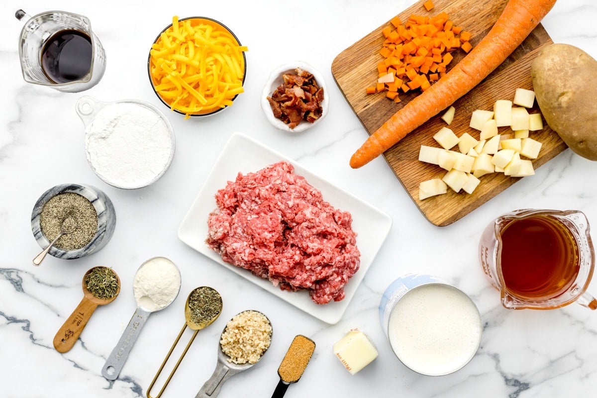 Ingredients measured and placed out on a counter for making cheeseburger soup recipe.