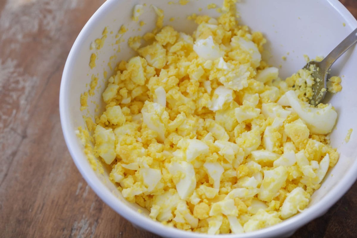 Chopped eggs in a bowl for how to make egg salad.
