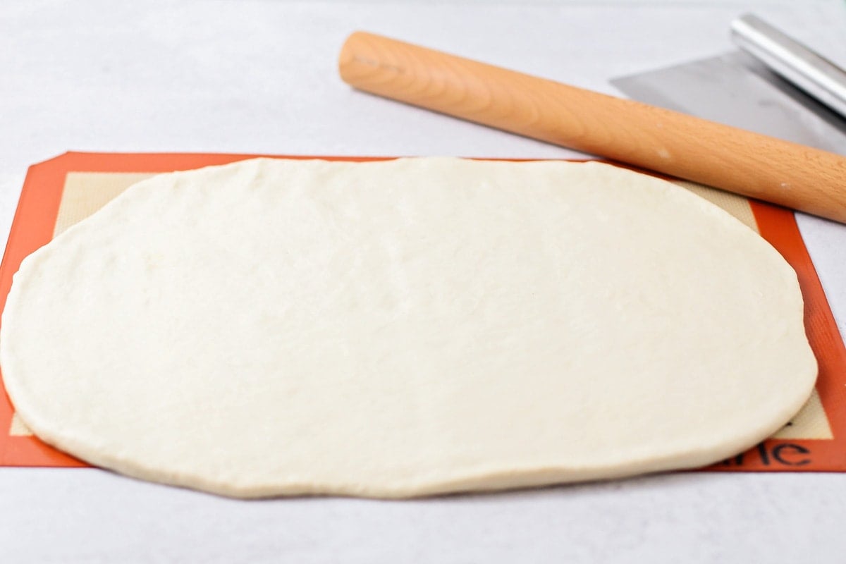Cutting, rolling, and prepping Italian loaves for baking.