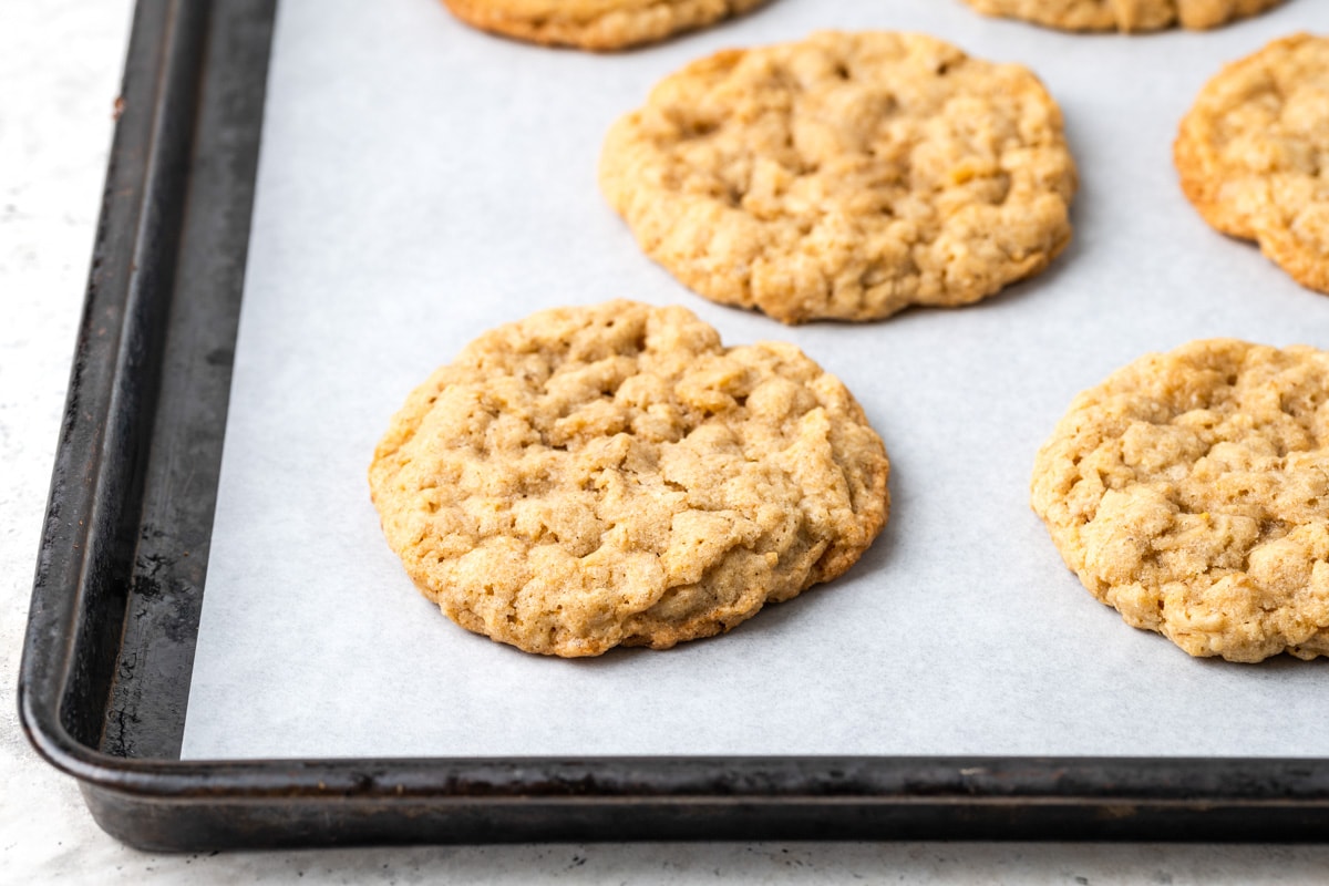 Baked easy oatmeal cookies on a baking sheet.