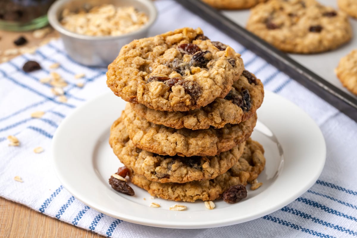 A stack of easy oatmeal raisin cookies on a white plate.
