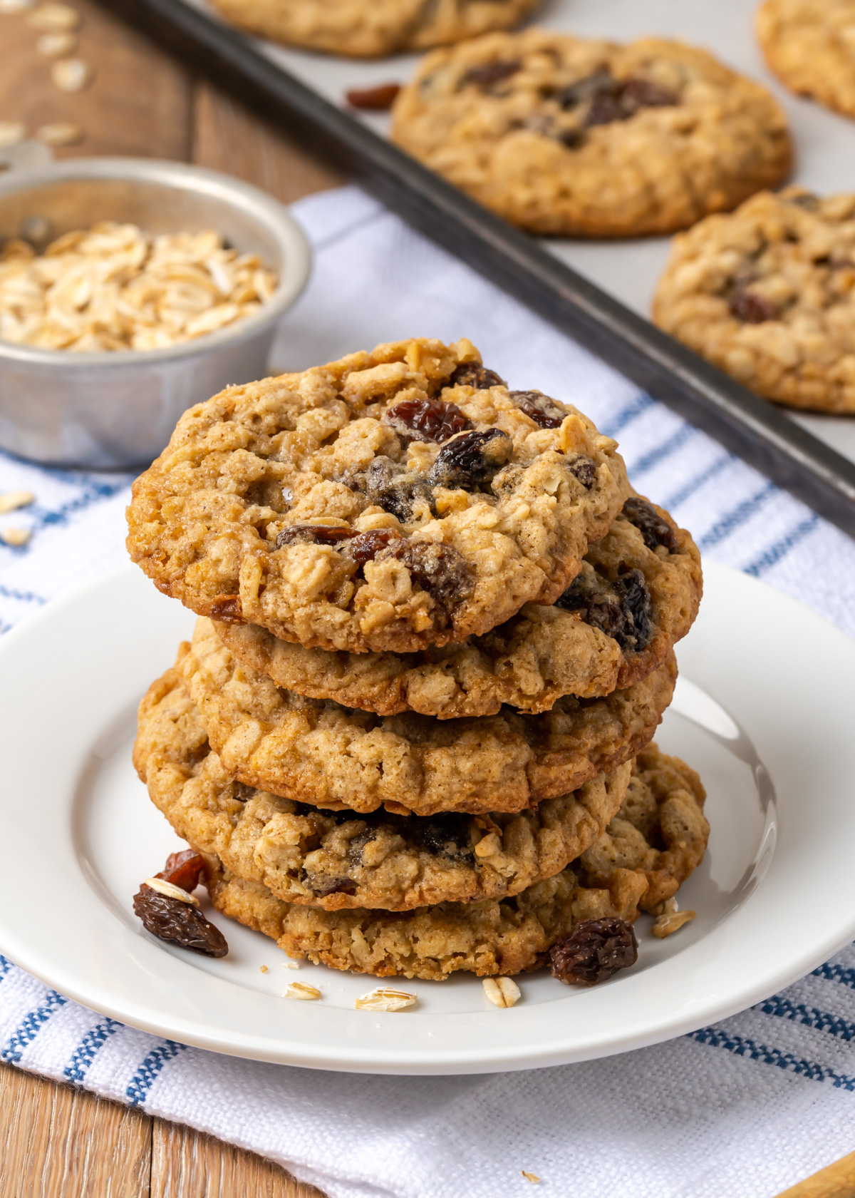 A stack of easy oatmeal raisin cookies on a white plate.