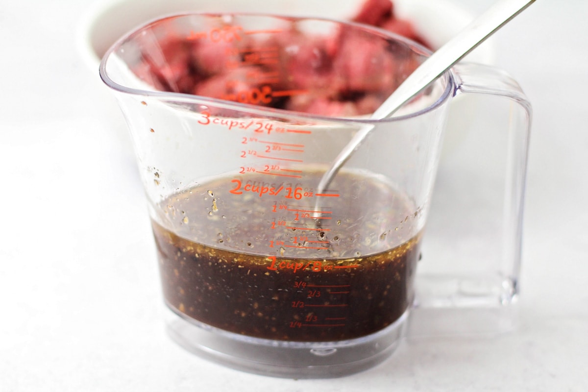 Marinade mixed in a measuring cup.