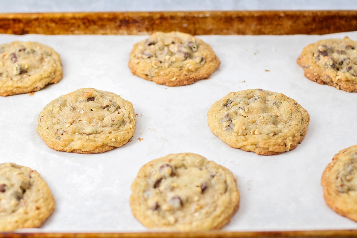 Nestle toll house cookies on baking sheet lined with parchment paper.