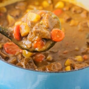 Beef stew recipe in a blue dutch oven.