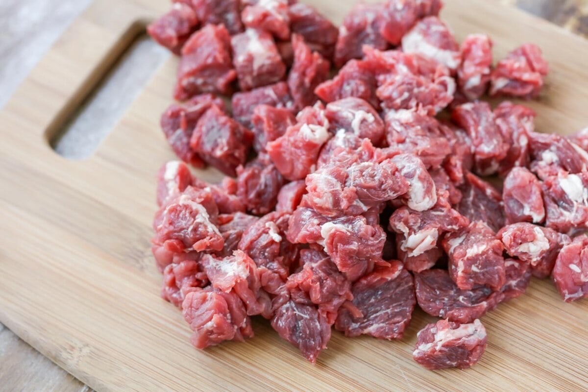 Chopped meat on cutting board for Beef Stroganoff Recipe.