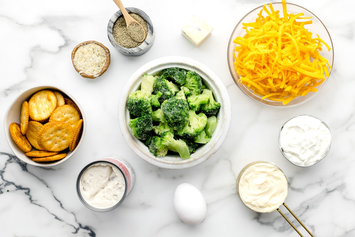 Measured broccoli and cheese ingredients on a kitchen counter.
