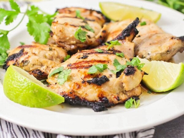 A white plate filled with cilantro lime chicken.