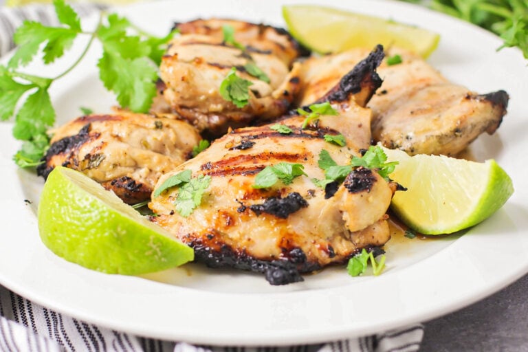 A white plate filled with cilantro lime chicken.