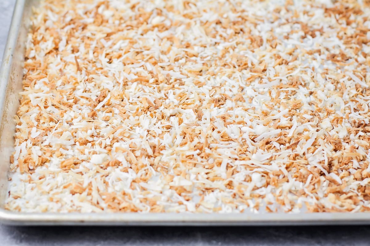 Toasted coconut on a metal sheet pan. 