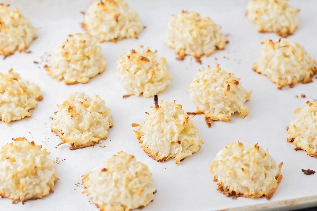 Toasted coconut macaroon recipe on a lined baking sheet.