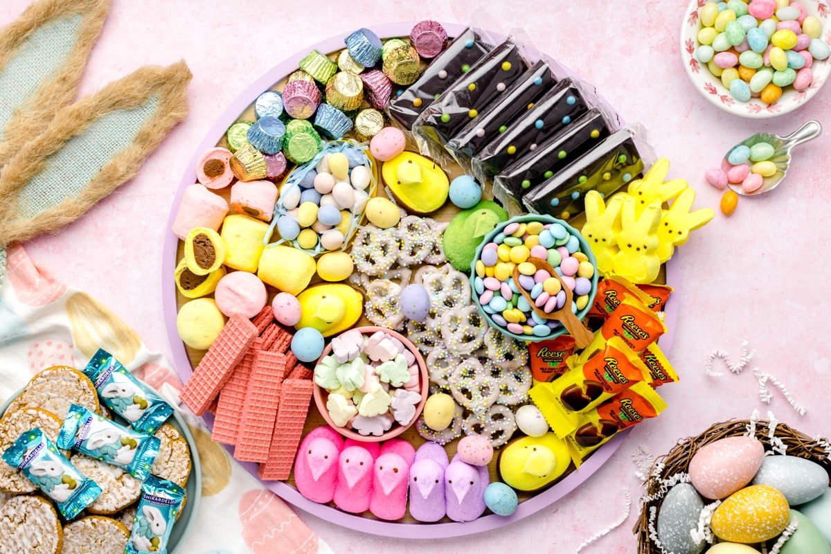 An Easter charcuterie board filled with seasonal Easter candies and treats.