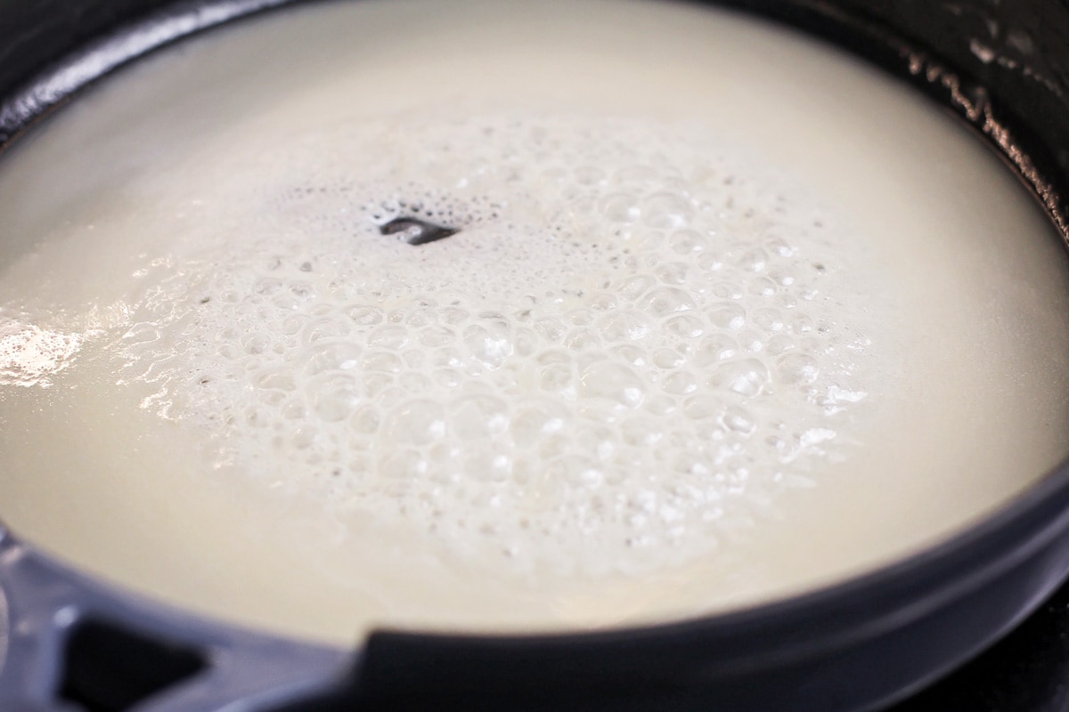 A roux bubbling in a pan on the stove.