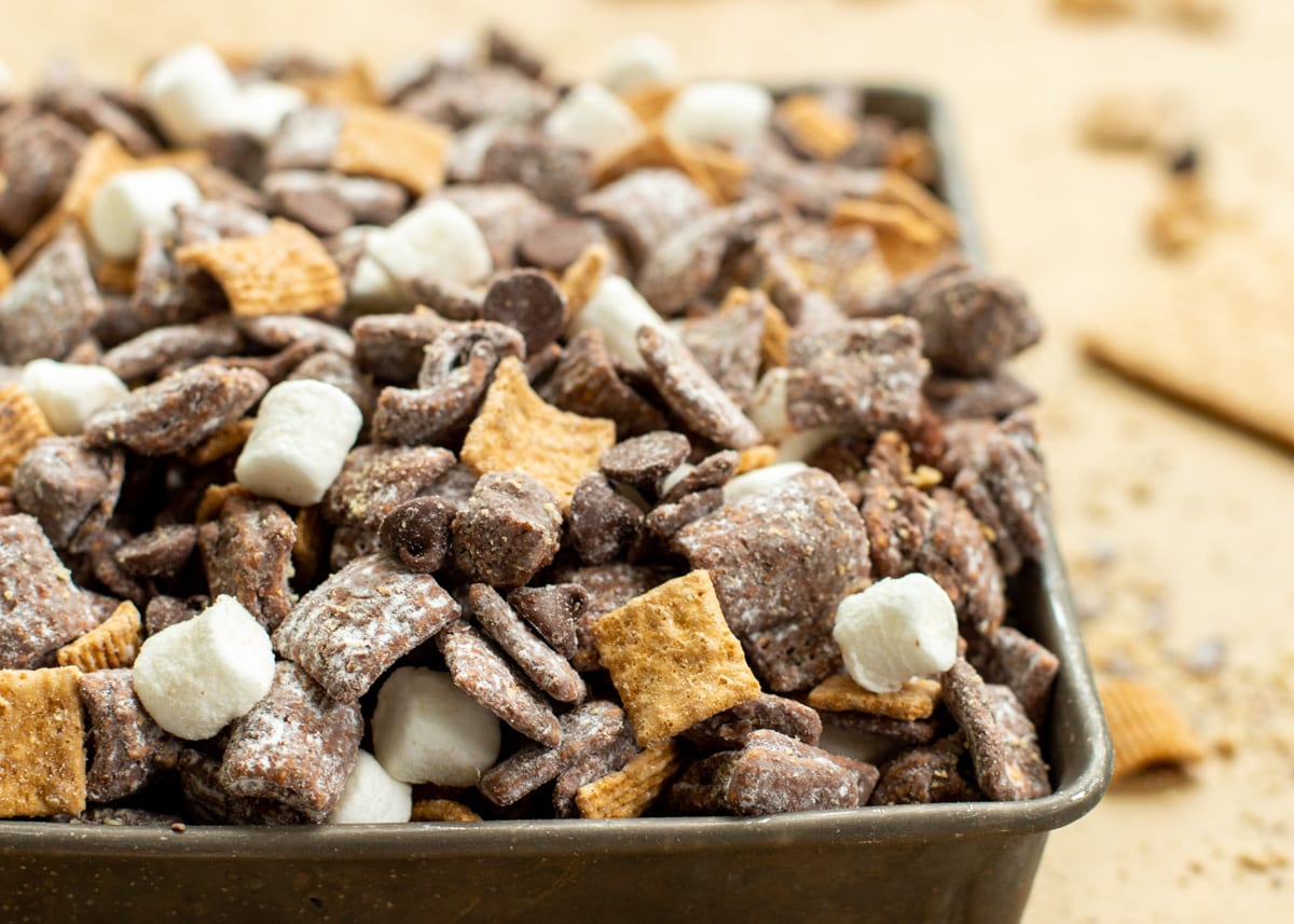 Close up of marshmallows, chocolate chips, and chex for S'mores Puppy Chow.