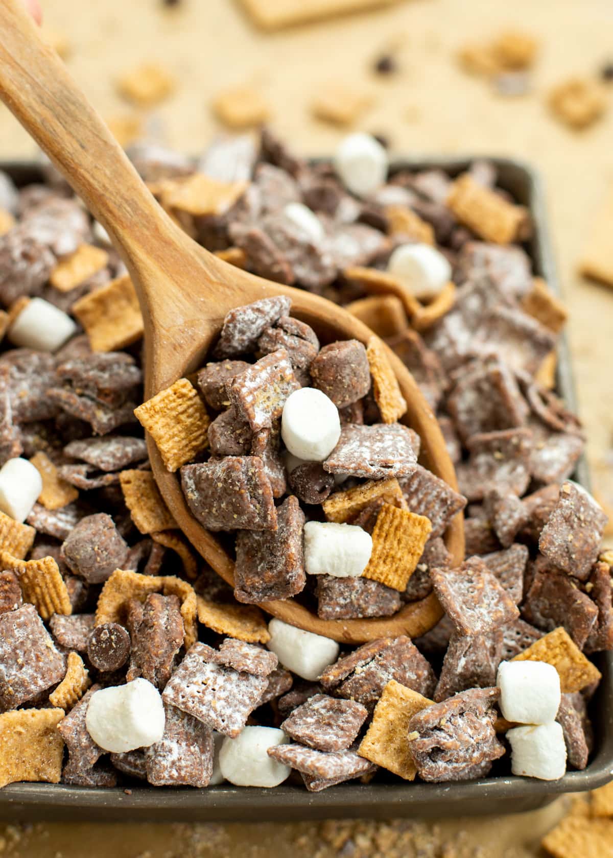 Close up of s'mores puppy chow served in a baking dish.