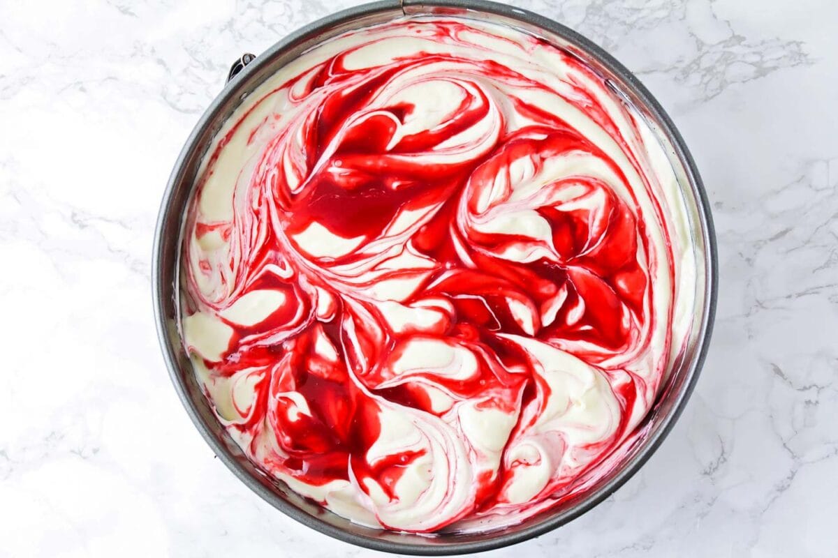 White chocolate and raspberry swirled cheesecake.