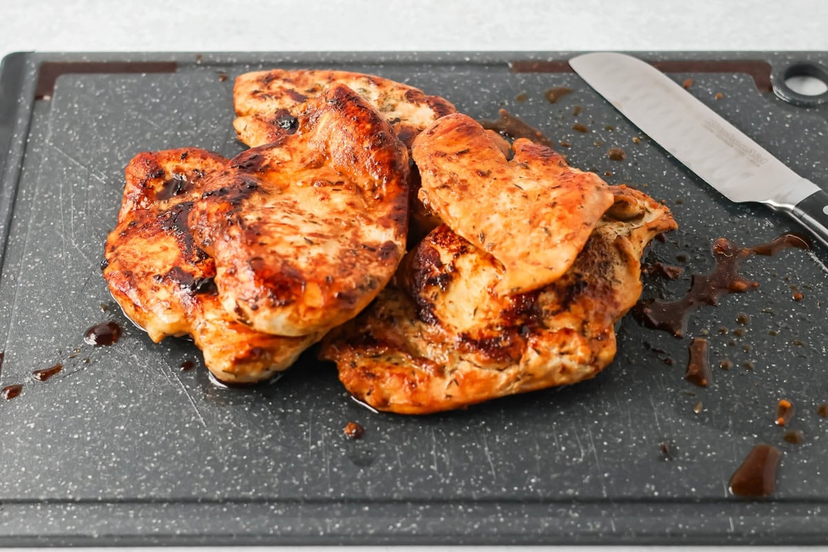 Slicing chicken for chicken alfredo bake.