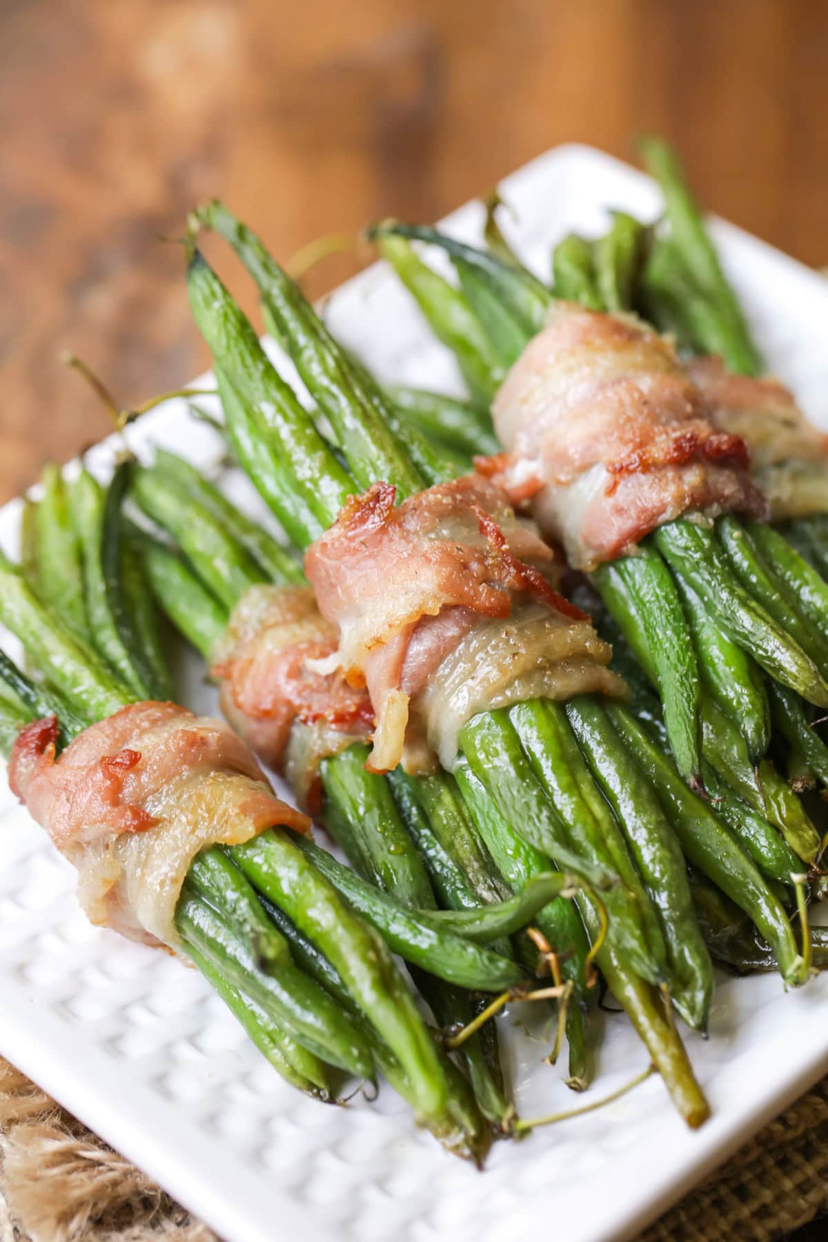 Close up of green bean bundles wrapped in bacon.