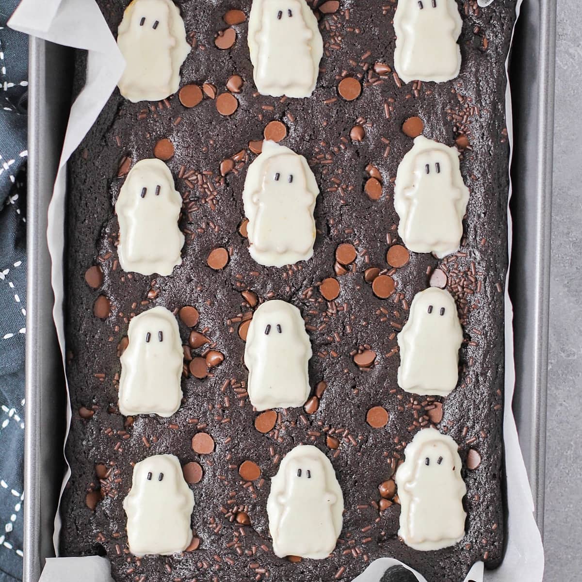 Cookies brownies topped with white chocolate Reese's Ghosts.