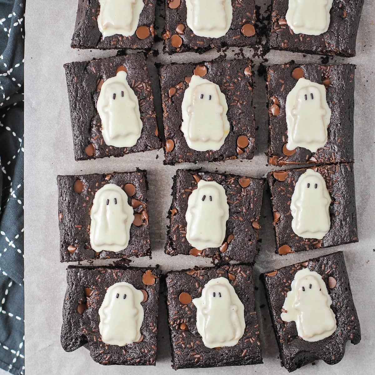 Cut halloween brownies topped with Reese's Ghosts.