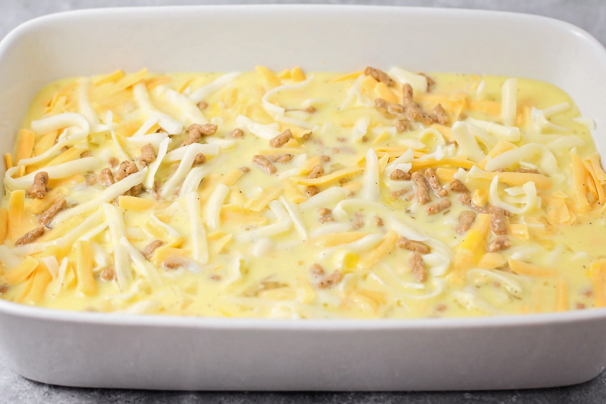 Cheese and sausage layered in baking dish.