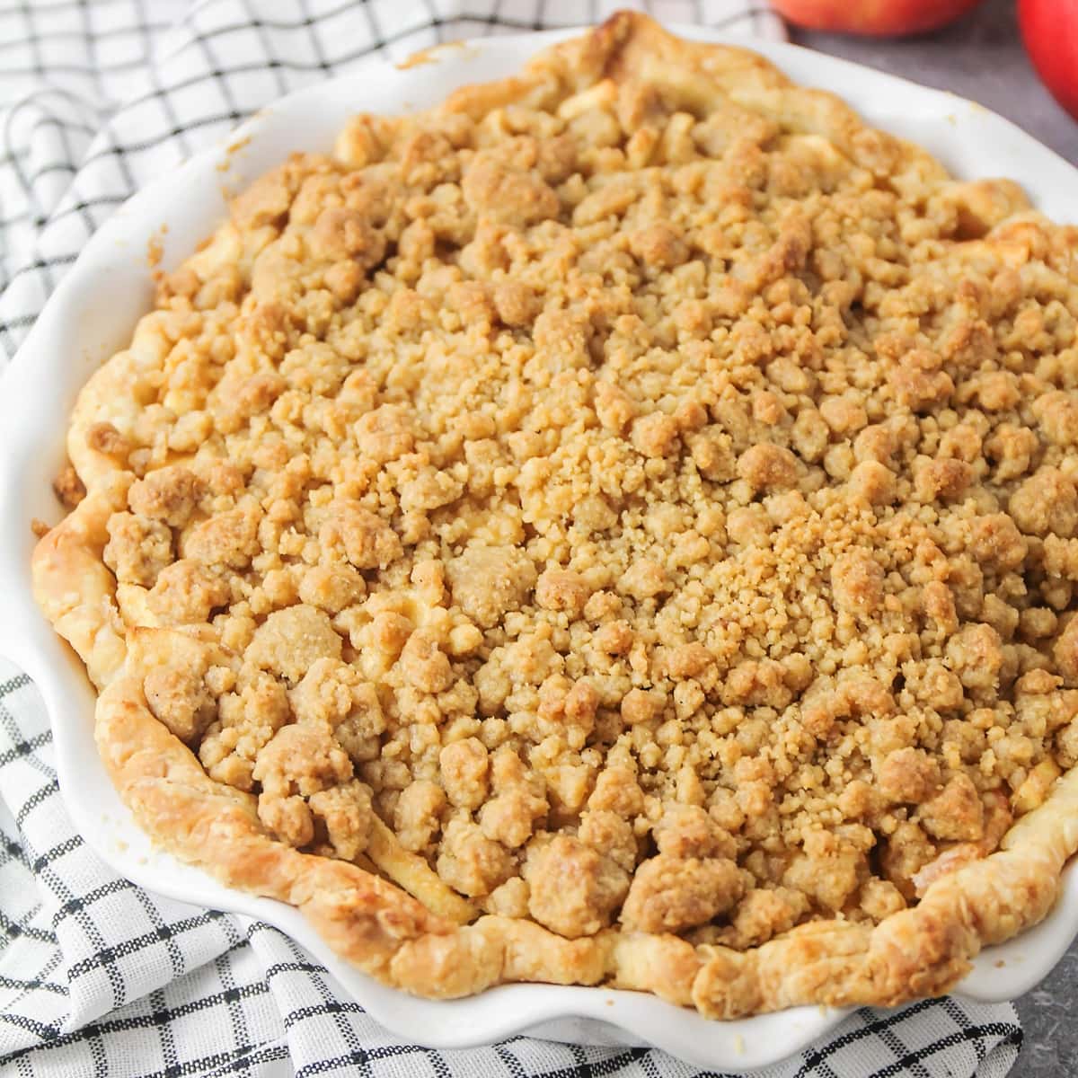 Crumb topping on a baked apple pie.