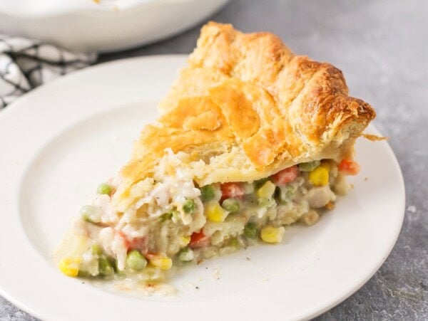 A slice of turkey pot pie on a white plate.