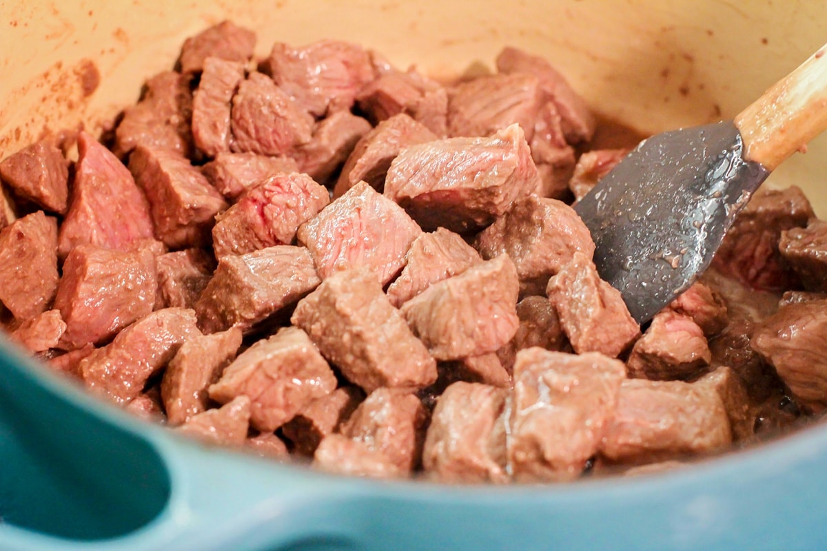 Cooked beef stew meat in a pot.