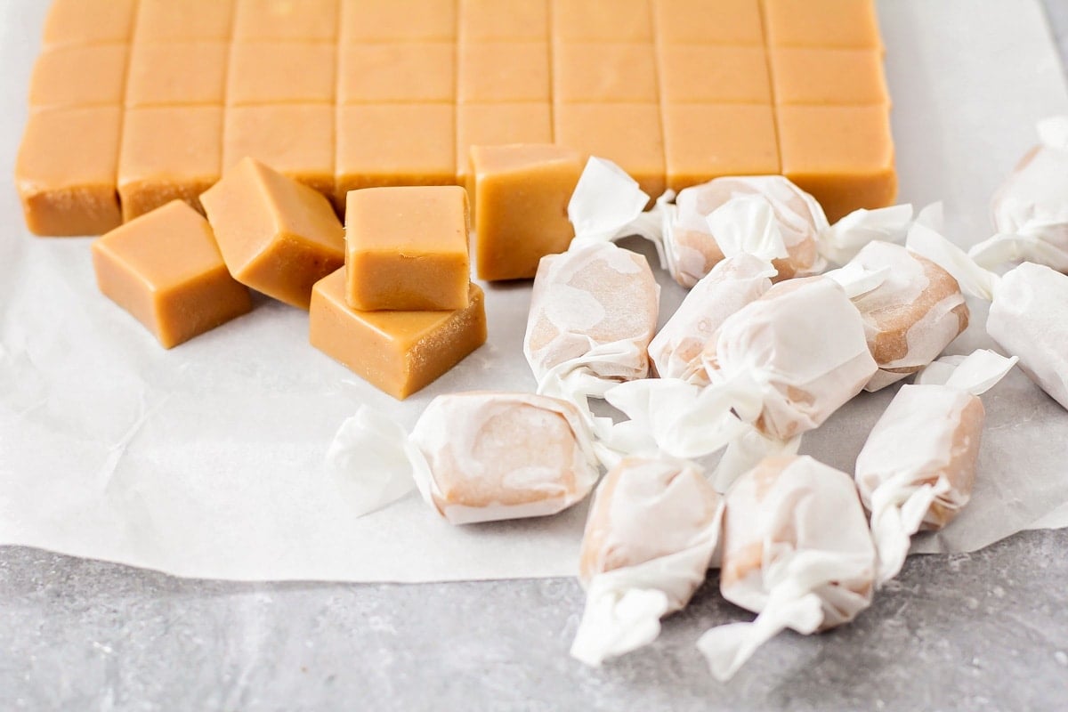Homemade caramels wrapped in wax paper.