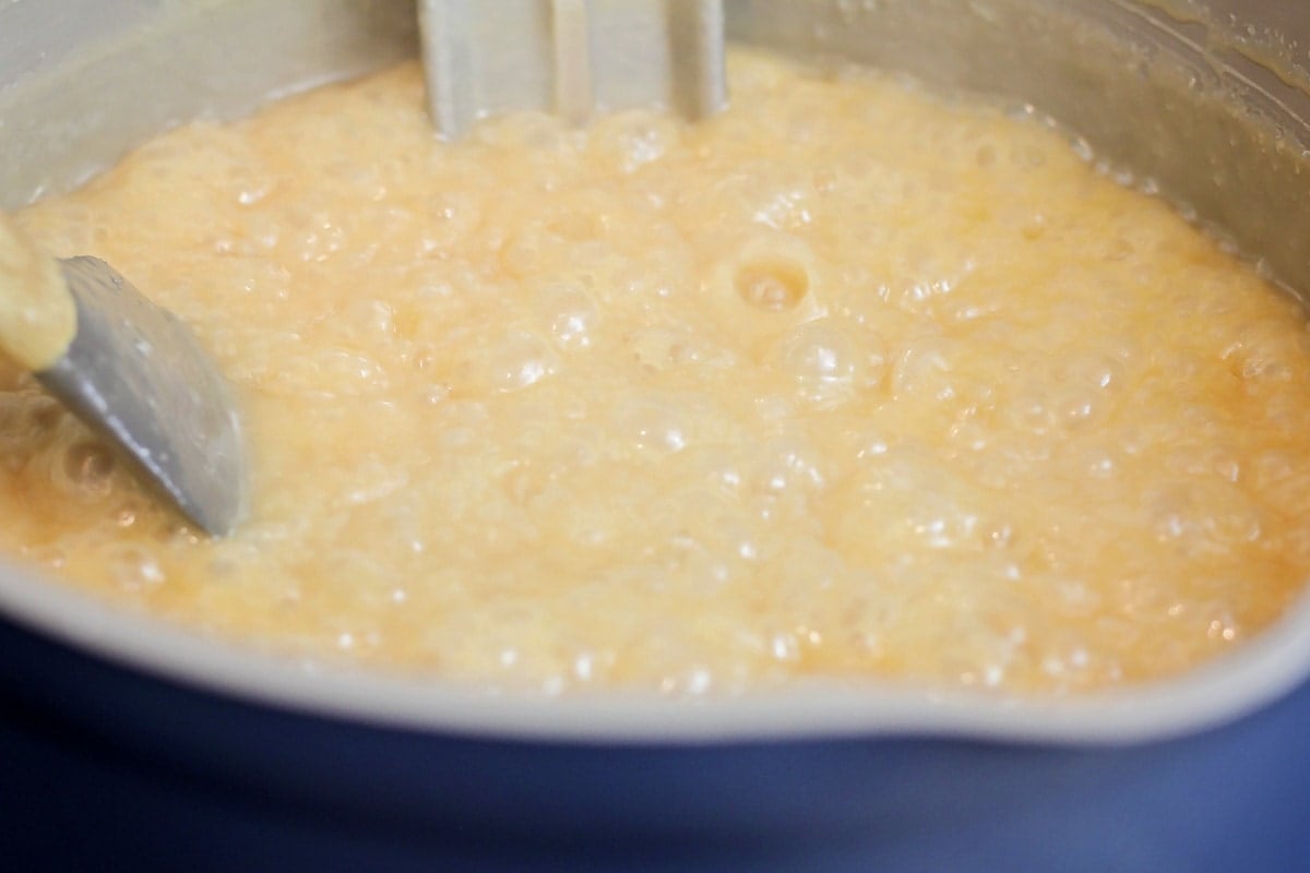 Butter sugar mixture boiling in a pot.