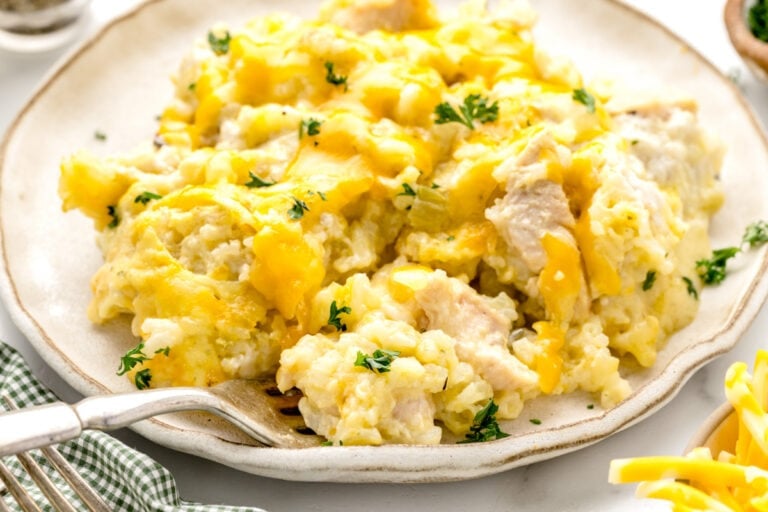 A serving of chicken and rice casserole on a white plate.