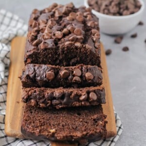 Sliced chocolate banana bread on a cutting board.