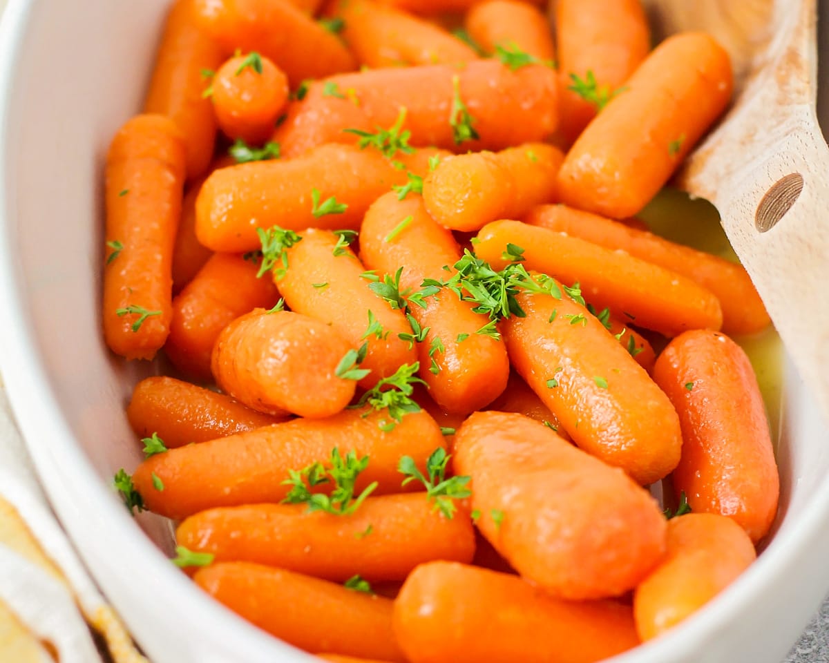 Honey glazed carrots topped with fresh herbs.