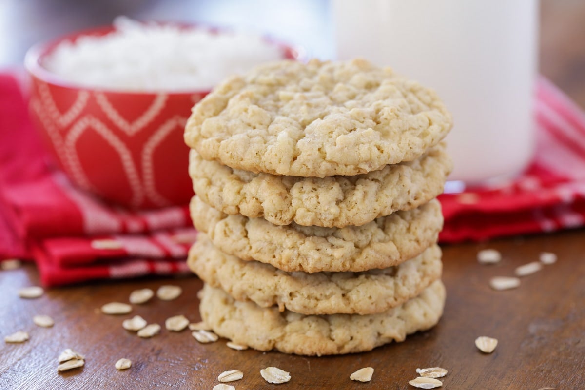 Oatmeal coconut cookies stacked on top of each other.