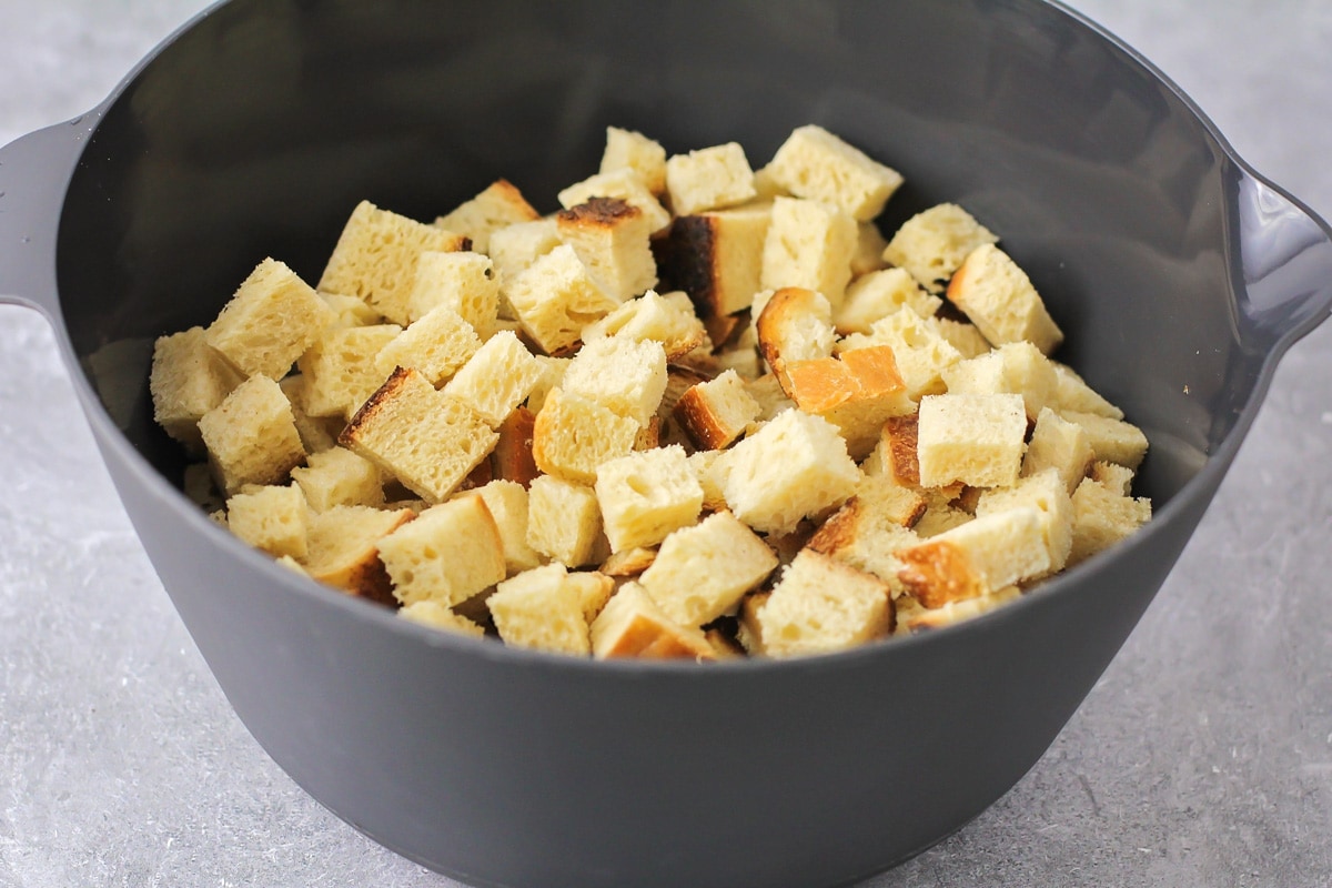 Bread cubes in a grey bowl.