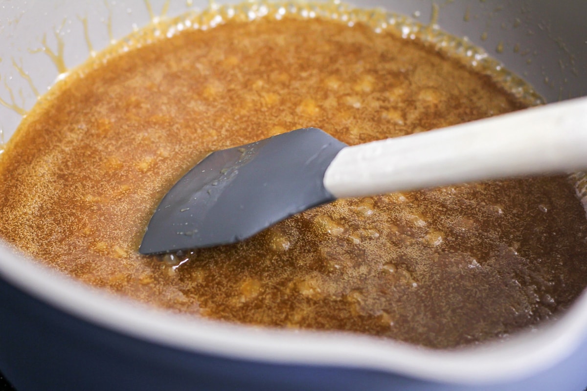 Melting sugar in a pot to make caramel.