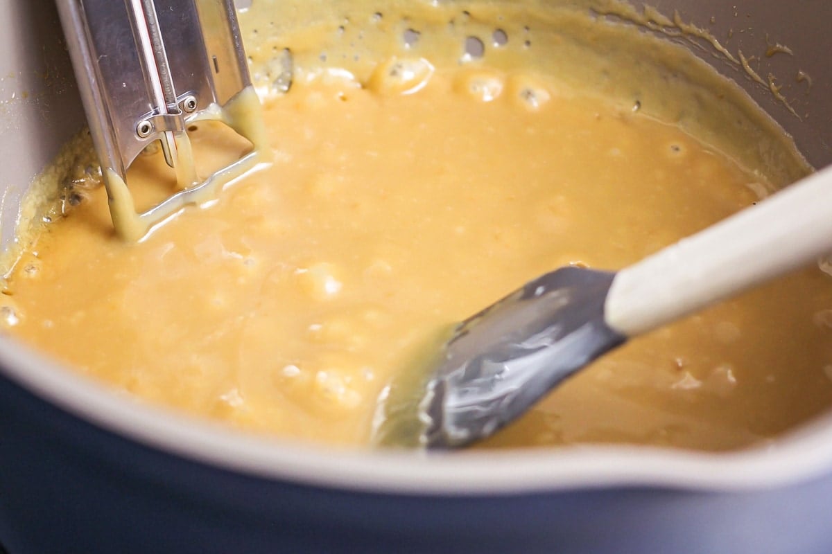 Making homemade caramel for turtles candy recipe.