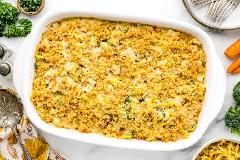 Chicken noodle casserole baked in a white baking dish.